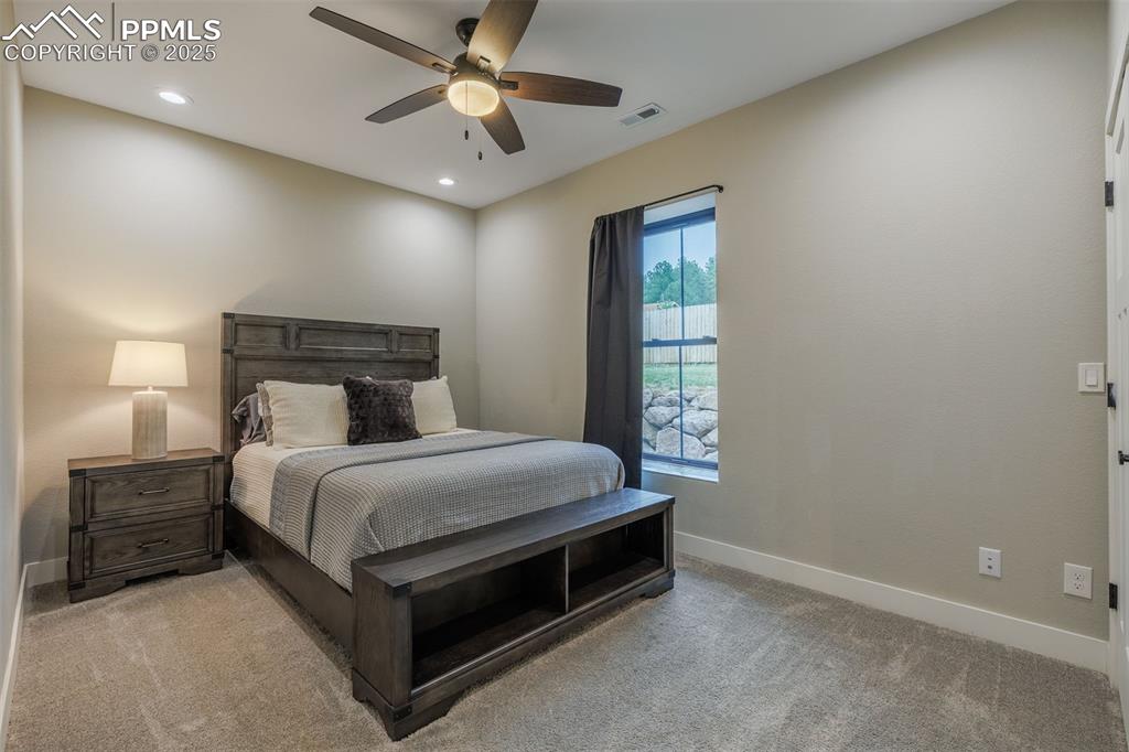 Image 29 of 38: Bedroom featuring light carpet, recessed lighting, and ceiling fan