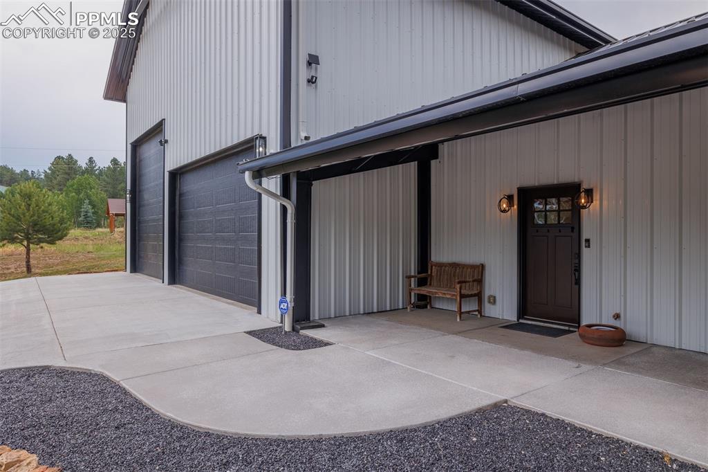 Image 6 of 38: Garage featuring driveway