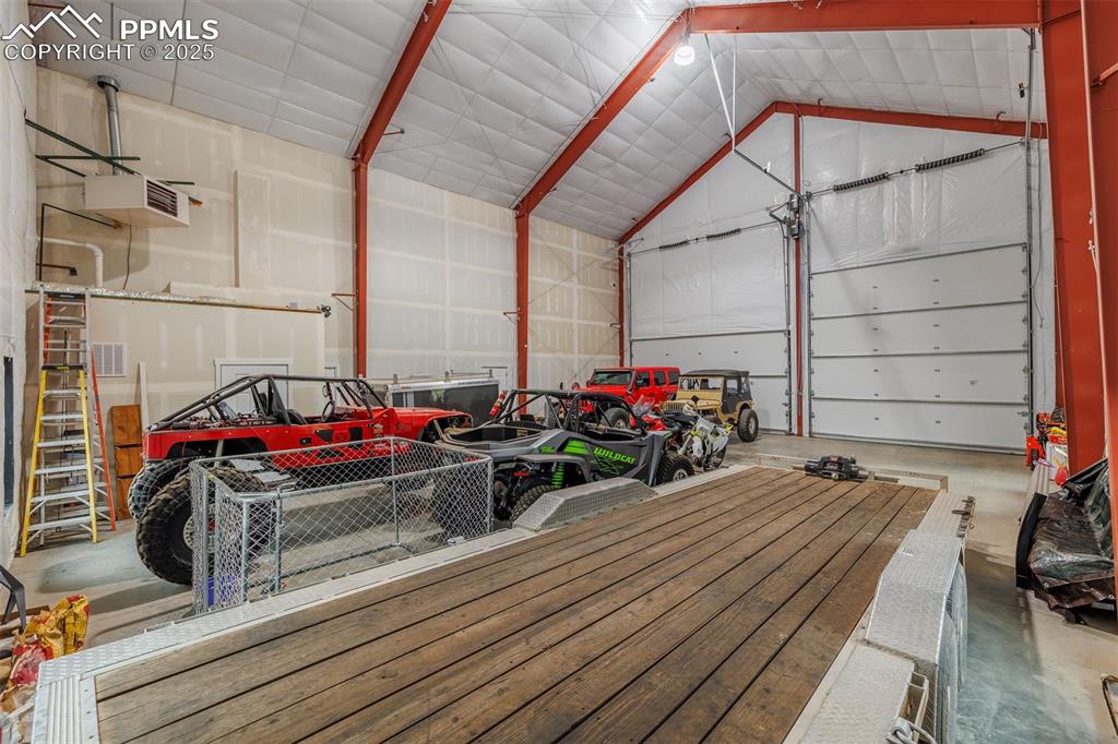 Image 8 of 38: Huge attached toy/RV garage fully insulated and heated  