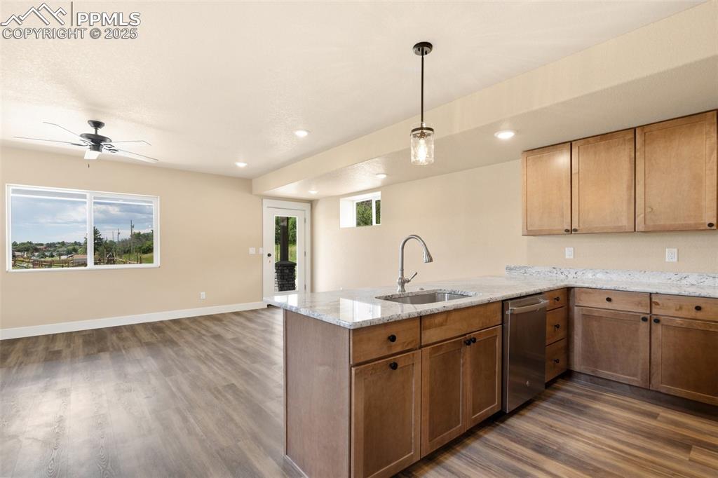 Image 10 of 33: Walkout to wrap around side porch from living room/kitchen/dining space