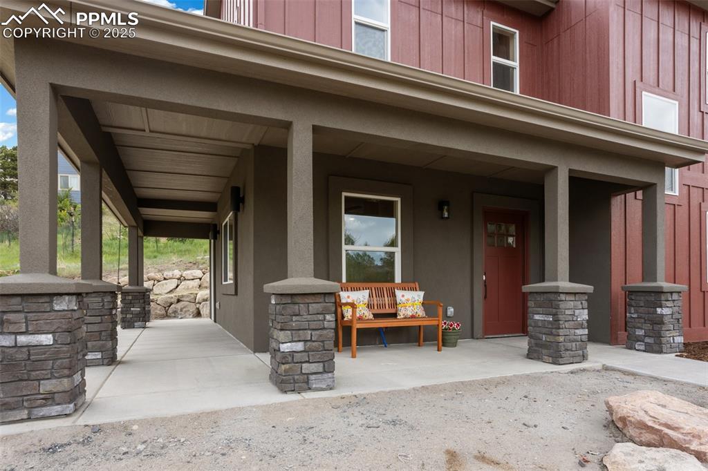 Image 12 of 33: Wrap around porch provides a wonderful covered outdoor area