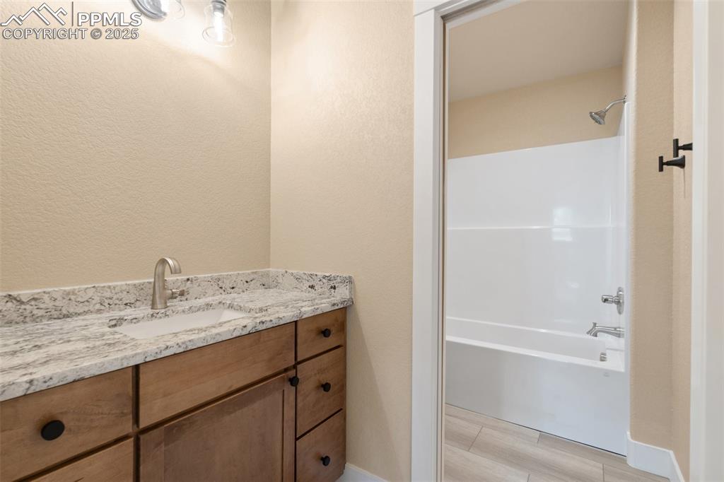 Image 26 of 33: Full guest bathroom on upper level (mirror to be installed prior to closing
