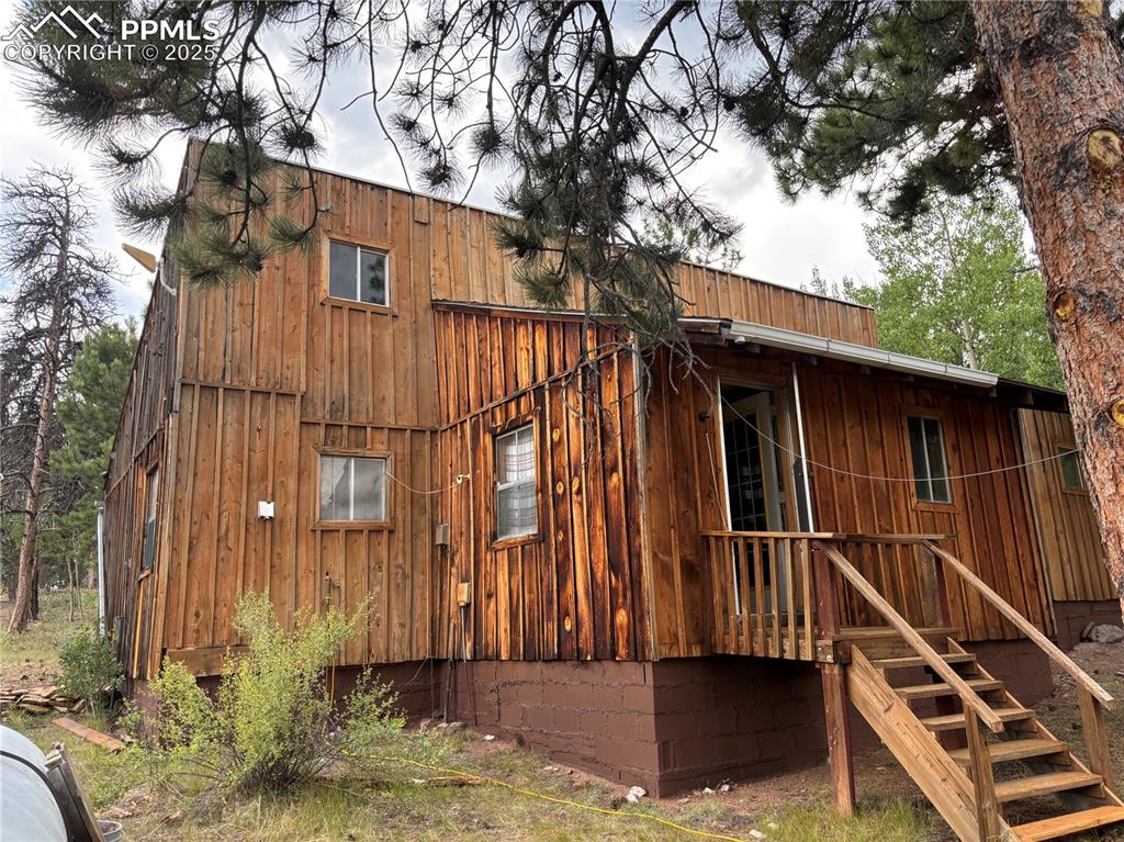 Image 3 of 40: View of property exterior featuring board and batten siding