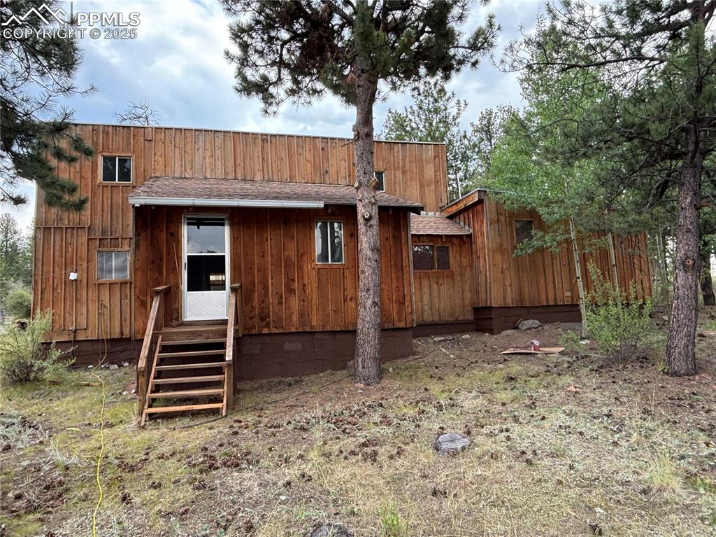 Image 6 of 40: Rear view of property with roof with shingles