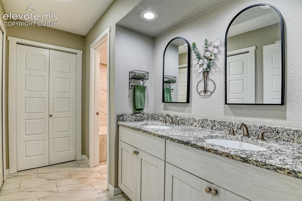 Image 17 of 33: Master bathroom double vanity.