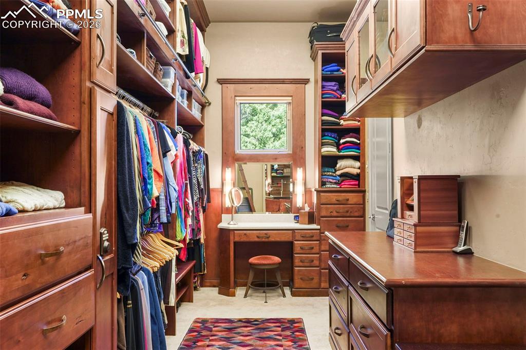 Image 25 of 50: Primary bedroom closet
