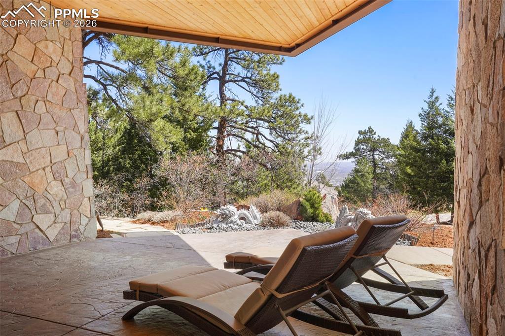 Image 44 of 50: One of several patios around the home