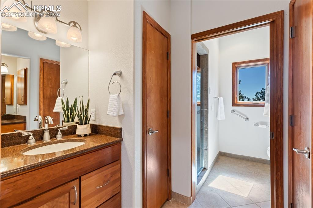 Image 37 of 43: Lower level 3/4 bath with radiant floors