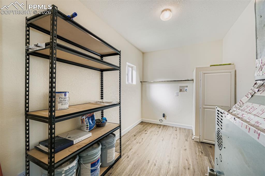 Image 30 of 38: Laundry room with plenty of storage