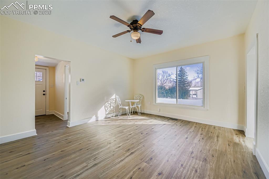 Image 4 of 38: Large, bright, and open room with plenty of space for dining and living roo