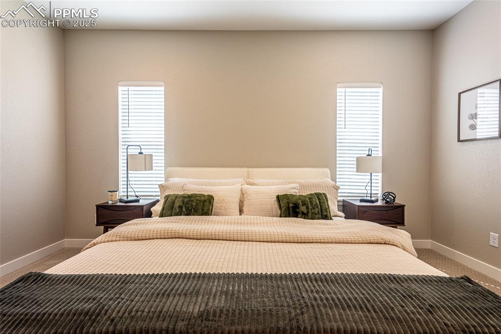 Image 24 of 43: Carpeted bedroom featuring baseboards
