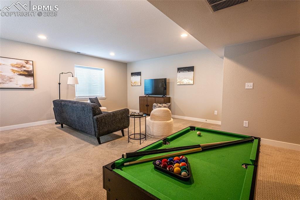 Image 33 of 43: Rec room featuring recessed lighting, carpet floors, visible vents, and bil