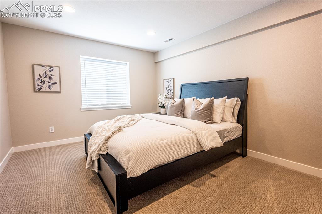 Image 42 of 43: Bedroom featuring recessed lighting, visible vents, baseboards, and light c