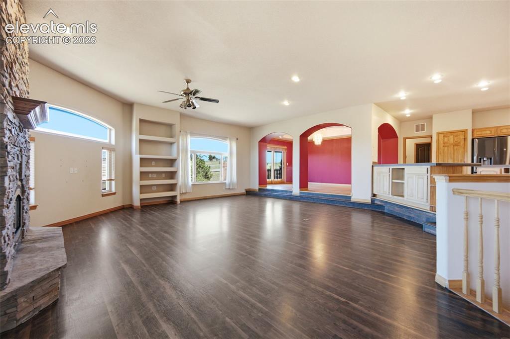 Image 11 of 39: Main living area opens to dining room