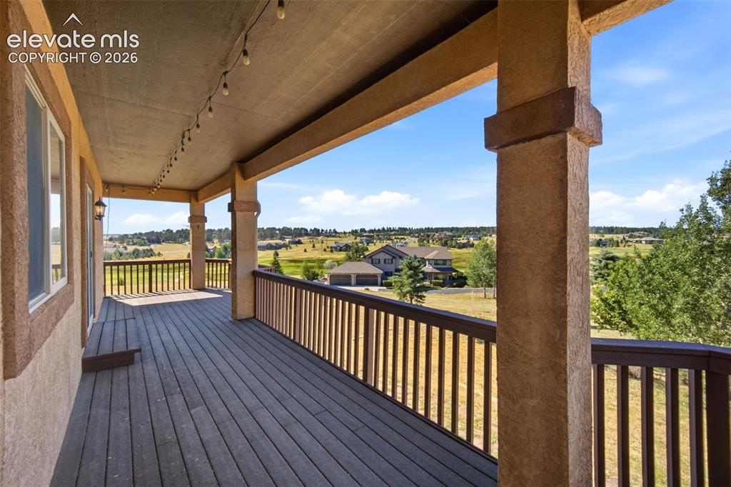 Image 13 of 39: Walkout from Living Room to covered deck