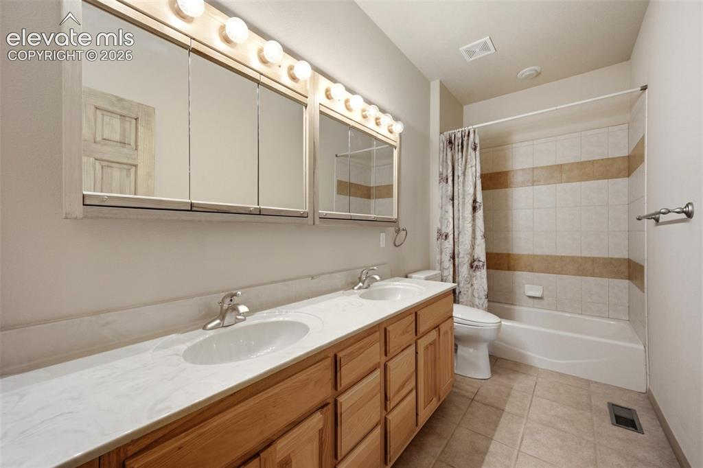 Image 17 of 39: Main level bath