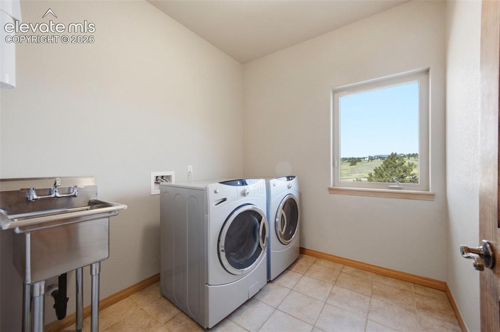 Image 22 of 39: Main level Laundry Room