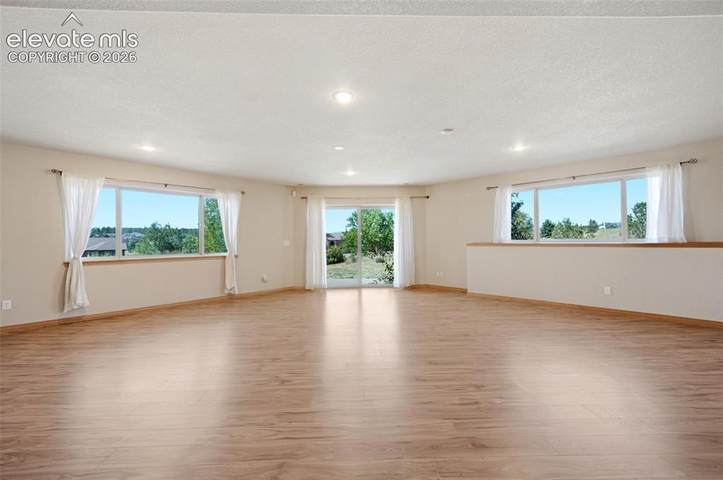 Image 25 of 39: Game Room with walkout to patio