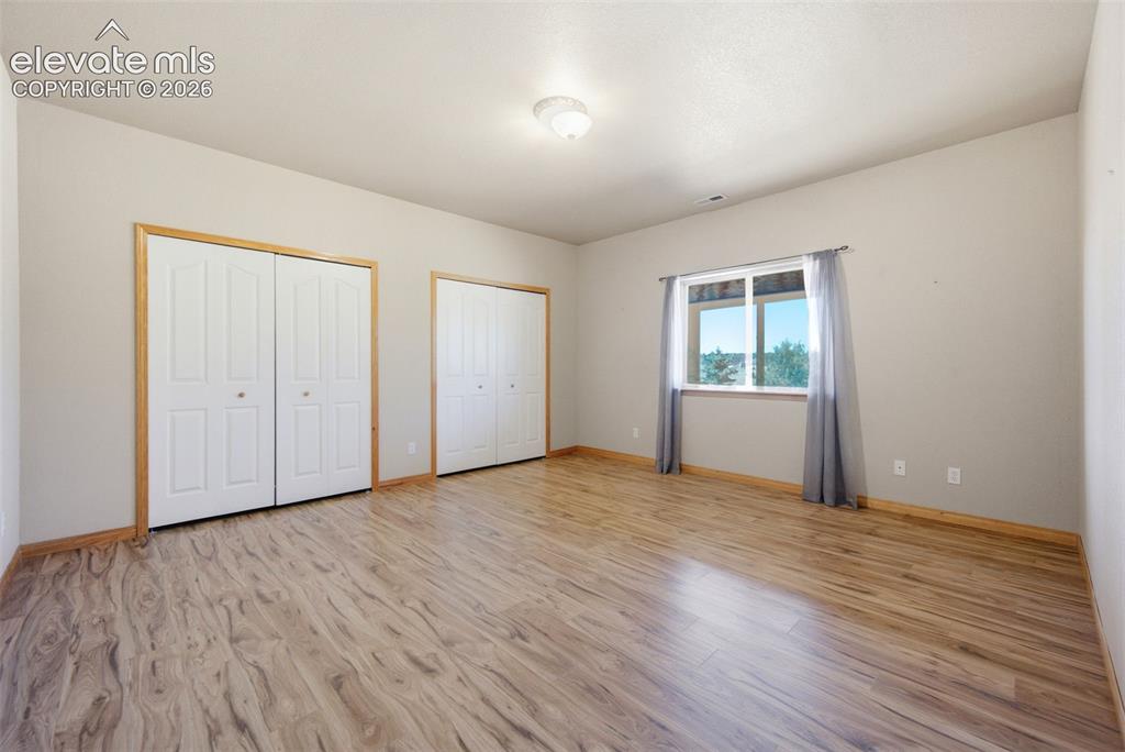 Image 28 of 39: One of two lower level bedrooms