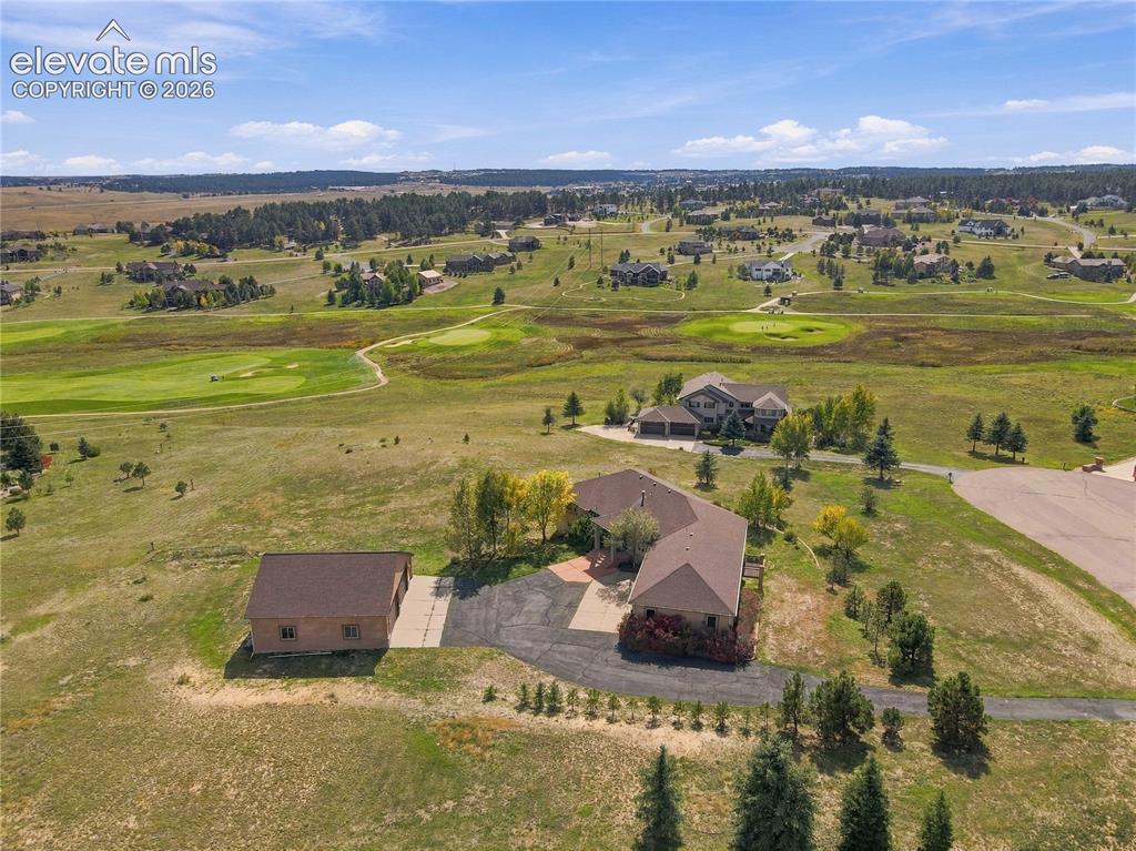 Image 46 of 48: Close to golf course with huge large garage surrounded by natural landscapi