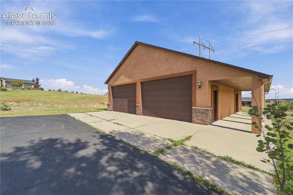 Image 5 of 48: Oversized detached garage withh room for up to 8 vehicles!