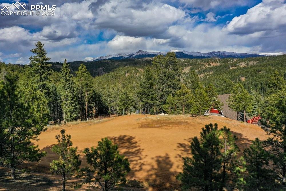 Image 14 of 34: Drone / aerial view featuring a view of trees and a mountain view