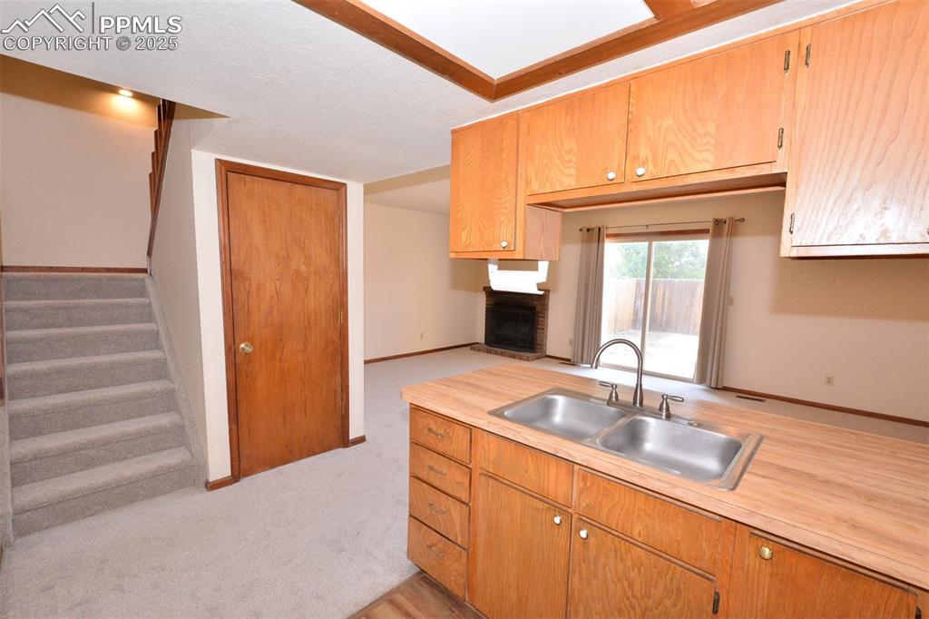 Image 10 of 20: Stairway to upper level