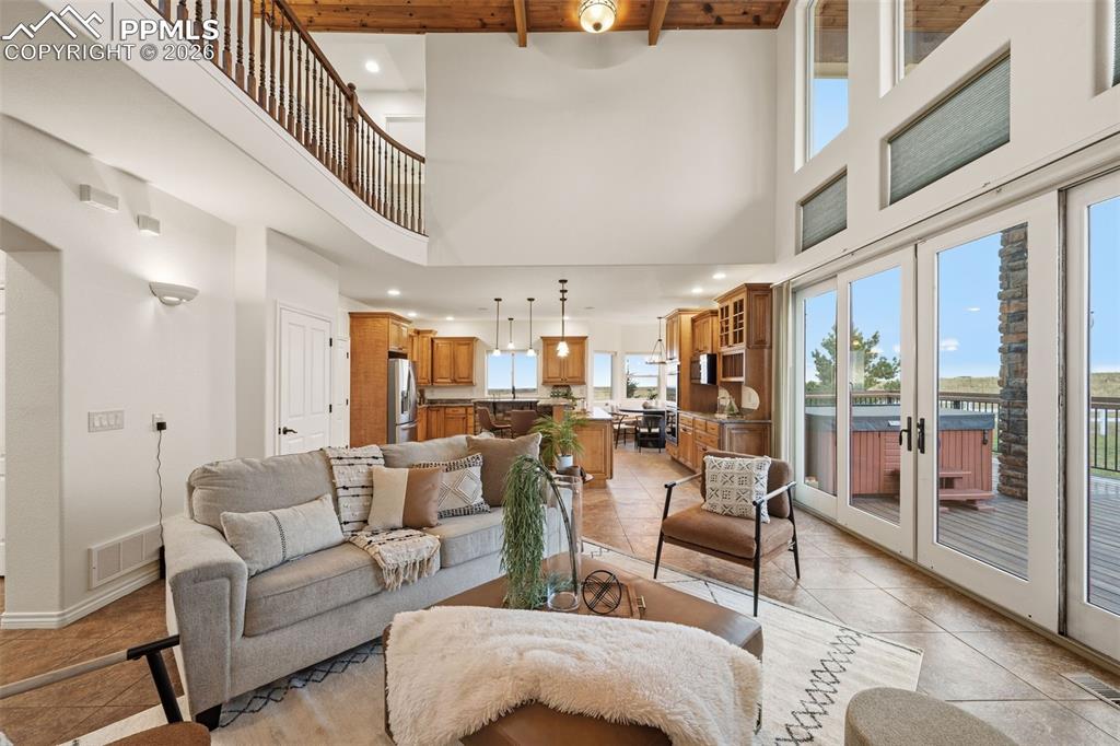 Image 11 of 50: Open and spacious living room leads to the well appointed kitchen.