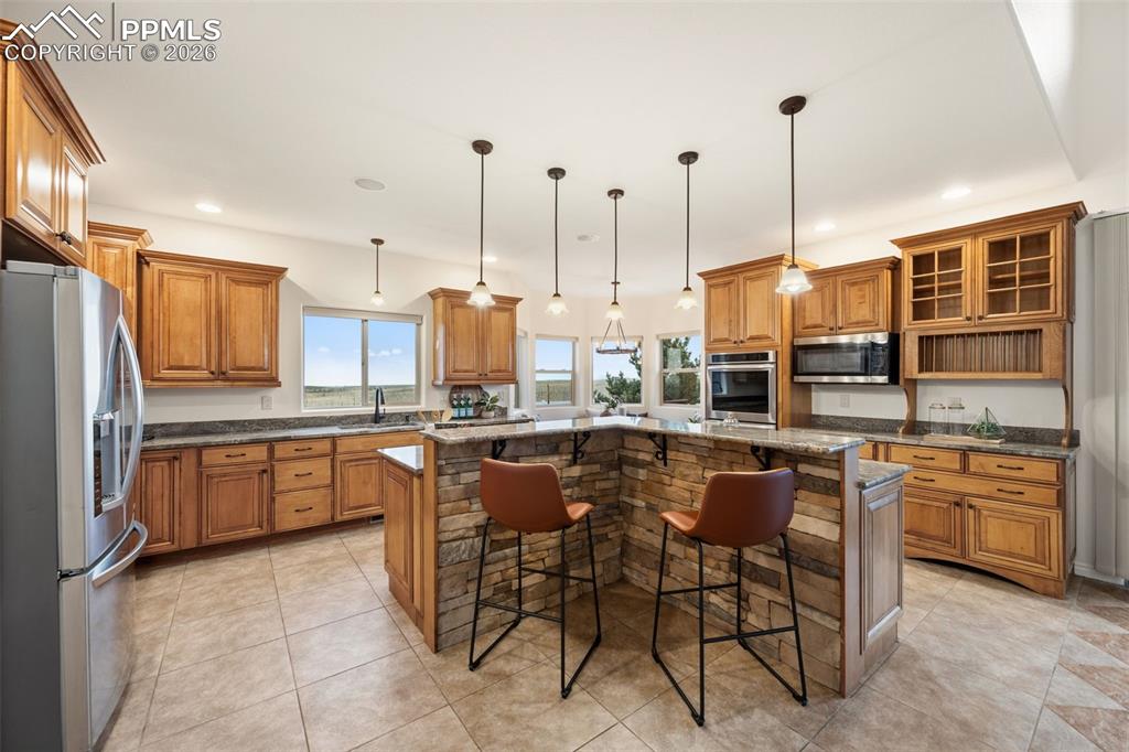 Image 12 of 50: New light fixtures over the breakfast bar