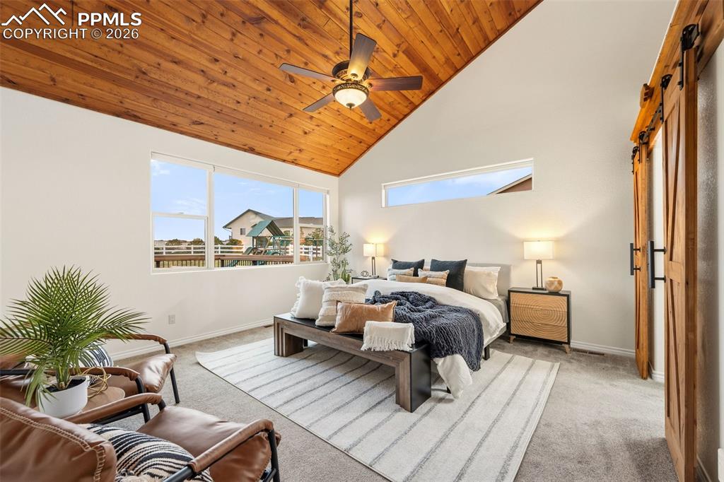 Image 16 of 50: Custom vaulted ceiling and west facing windows