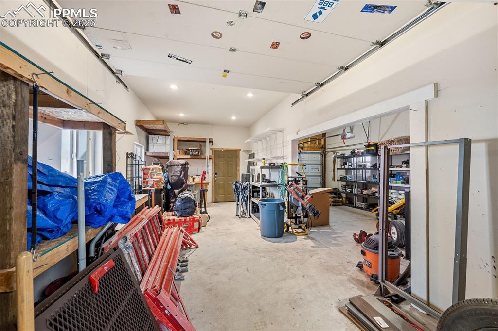 Image 46 of 50: Workshop area opens to garage or storage area