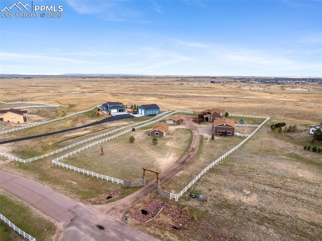 Image 49 of 50: Colorado living - 2.5 acres, 4 buildings, fenced, and a windmill!