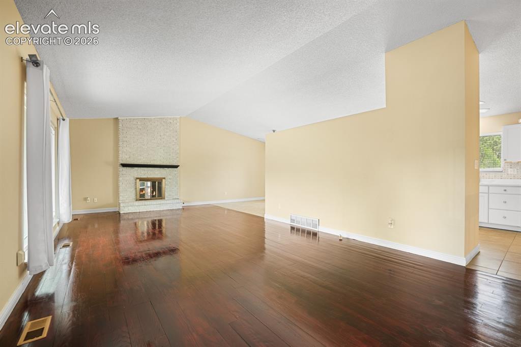 Image 10 of 49: Living room from the front door. 