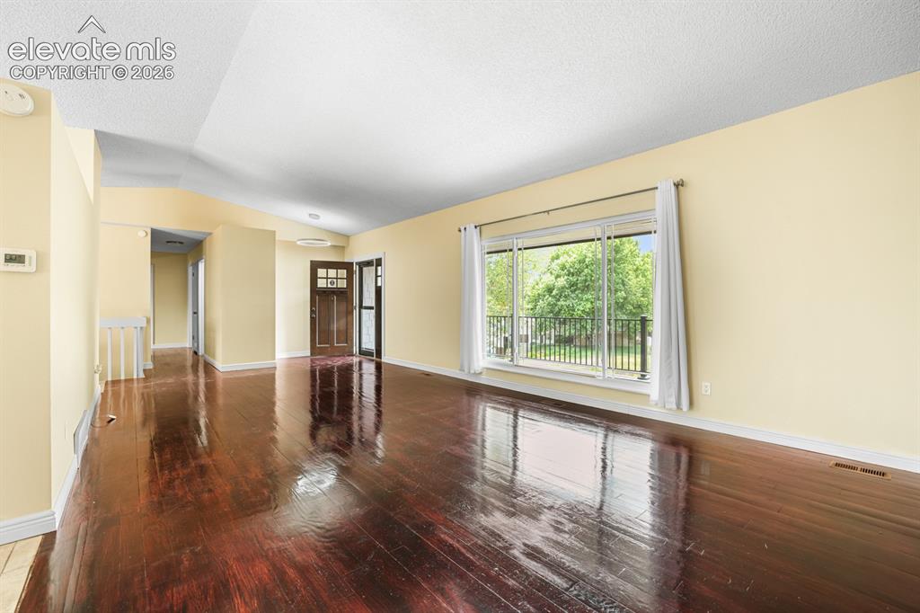 Image 11 of 49: Living room with opposite view of the previous photo.  
