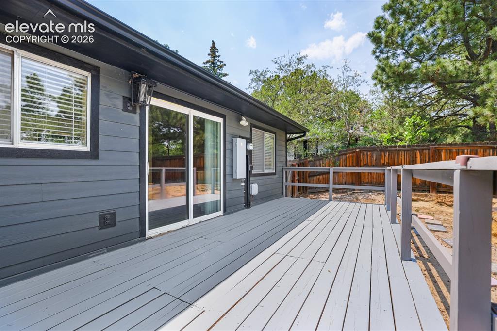Image 17 of 49: Another view of the huge deck right off the kitchen for easy convenience ou