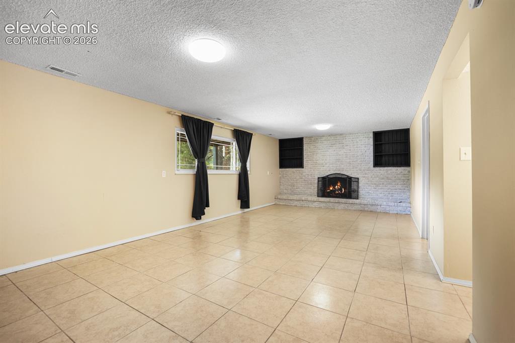 Image 38 of 49: beautiful Family level living room walking in from the garage and upstairs 