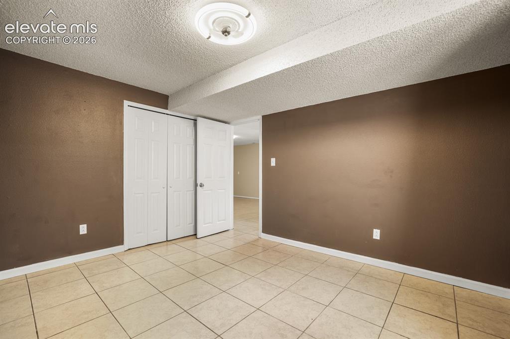 Image 41 of 49: opposite view of the 4th bedroom located downstairs.   