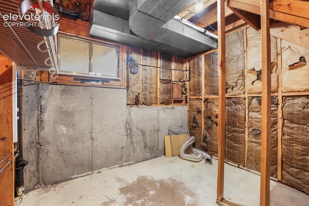Image 43 of 49: Big Utility room located in the garden level basement with plenty of room f