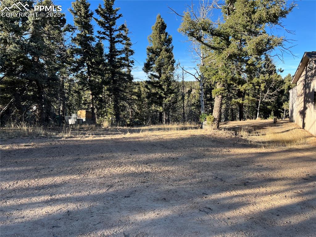 Image 10 of 10: Nice side yard offers some good outside space for extra parking