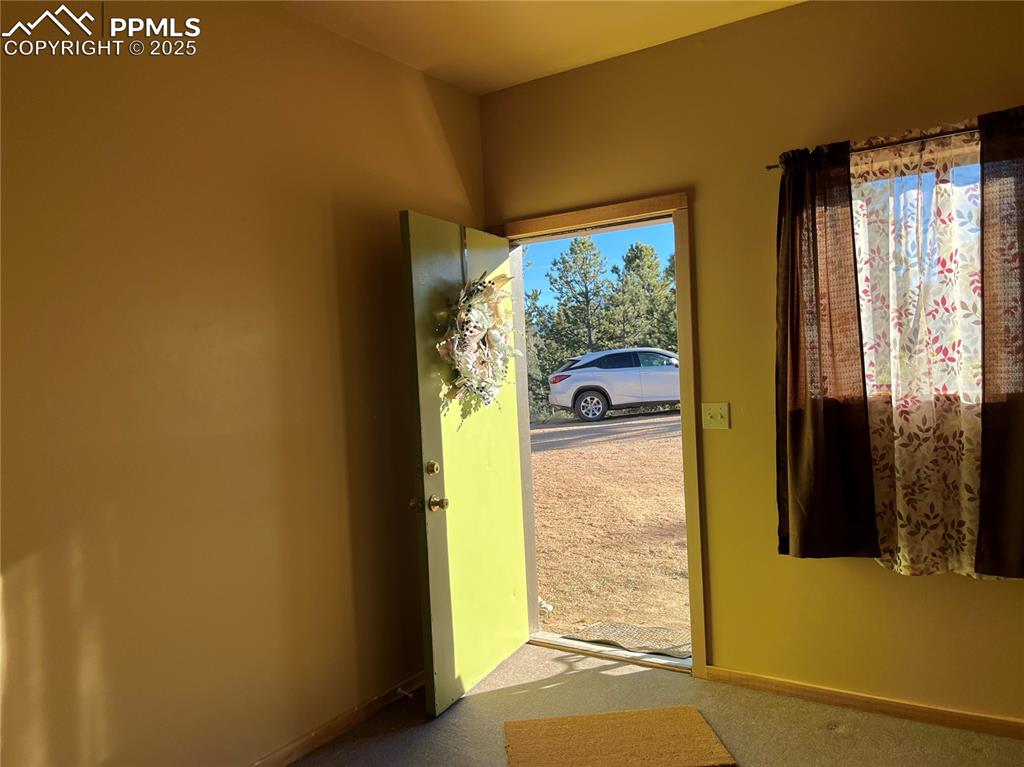 Image 3 of 10: looking out to front parking from office area