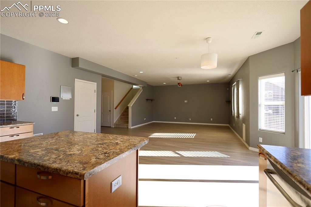 Image 13 of 41: Kitchen with light hardwood / wood-style flooring