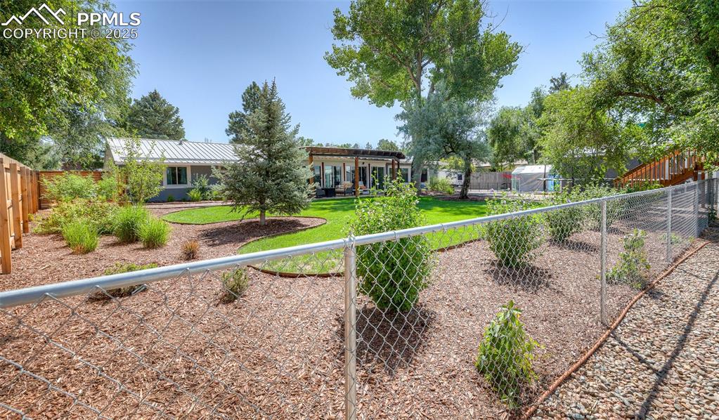 Image 32 of 46: Detached Garage and Shed