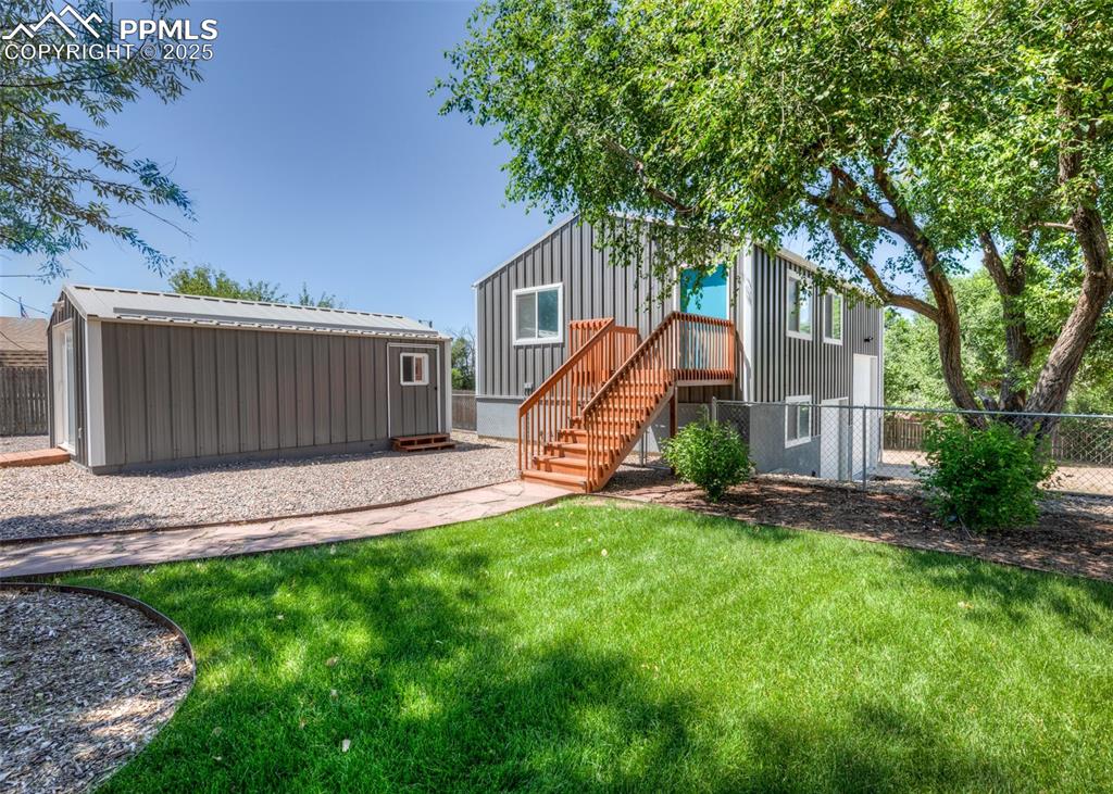 Image 33 of 46: Detached Garage and Shed