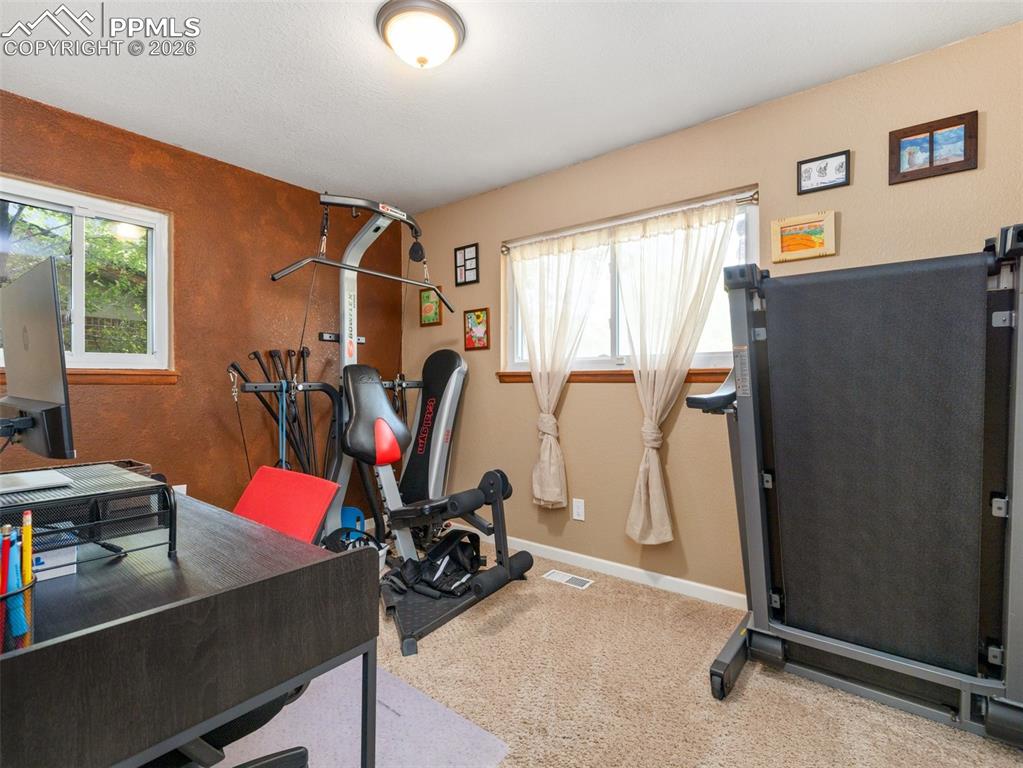 Image 19 of 50: Main floor guest bedroom