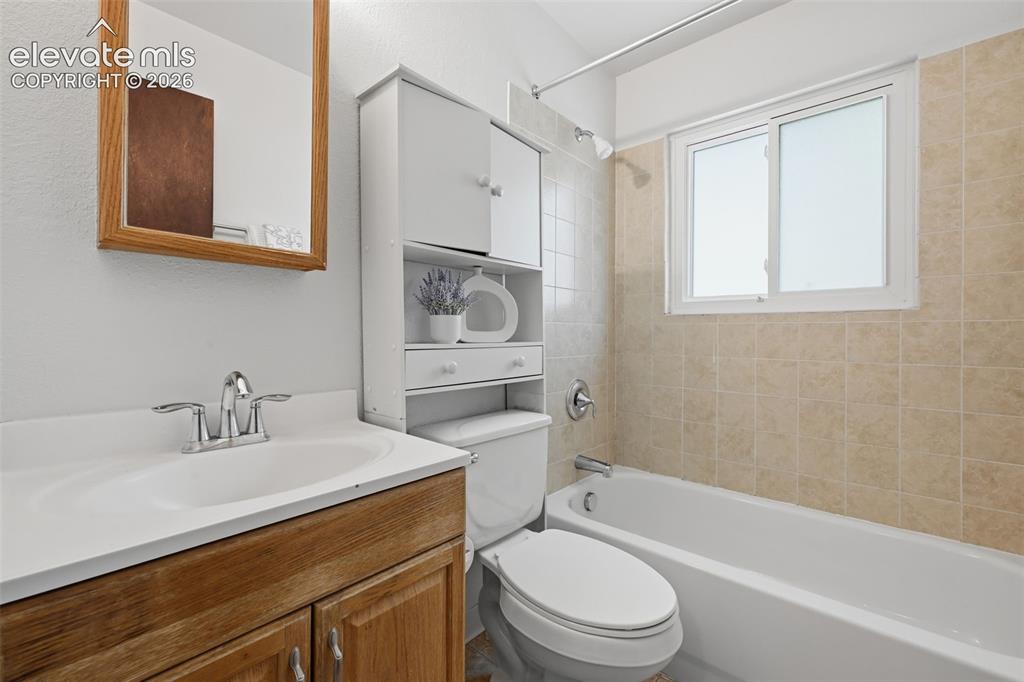 Image 15 of 35: Main level full bathroom with window