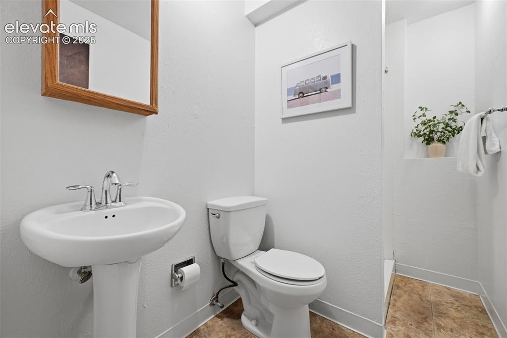 Image 23 of 35: Downstairs bathroom with walk in shower!