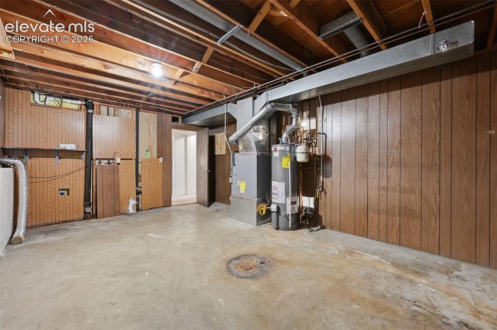 Image 26 of 35: Spacious storage room and laundry space! Connects to garage