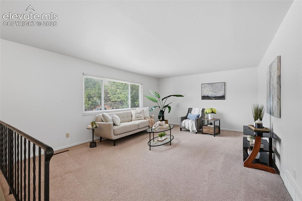 Image 5 of 35: Large family room with tons of natural light and views!