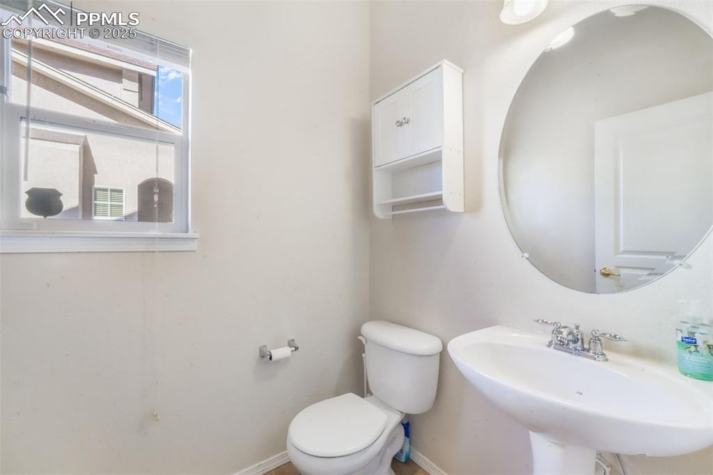 Image 17 of 50: Half bathroom featuring toilet and baseboards