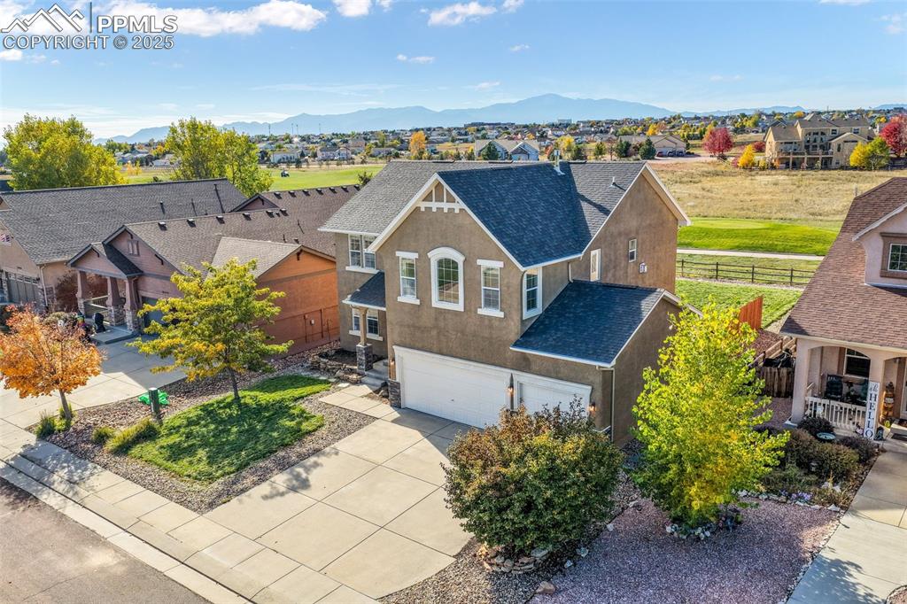 Image 2 of 50: Aerial view of residential area featuring mountains